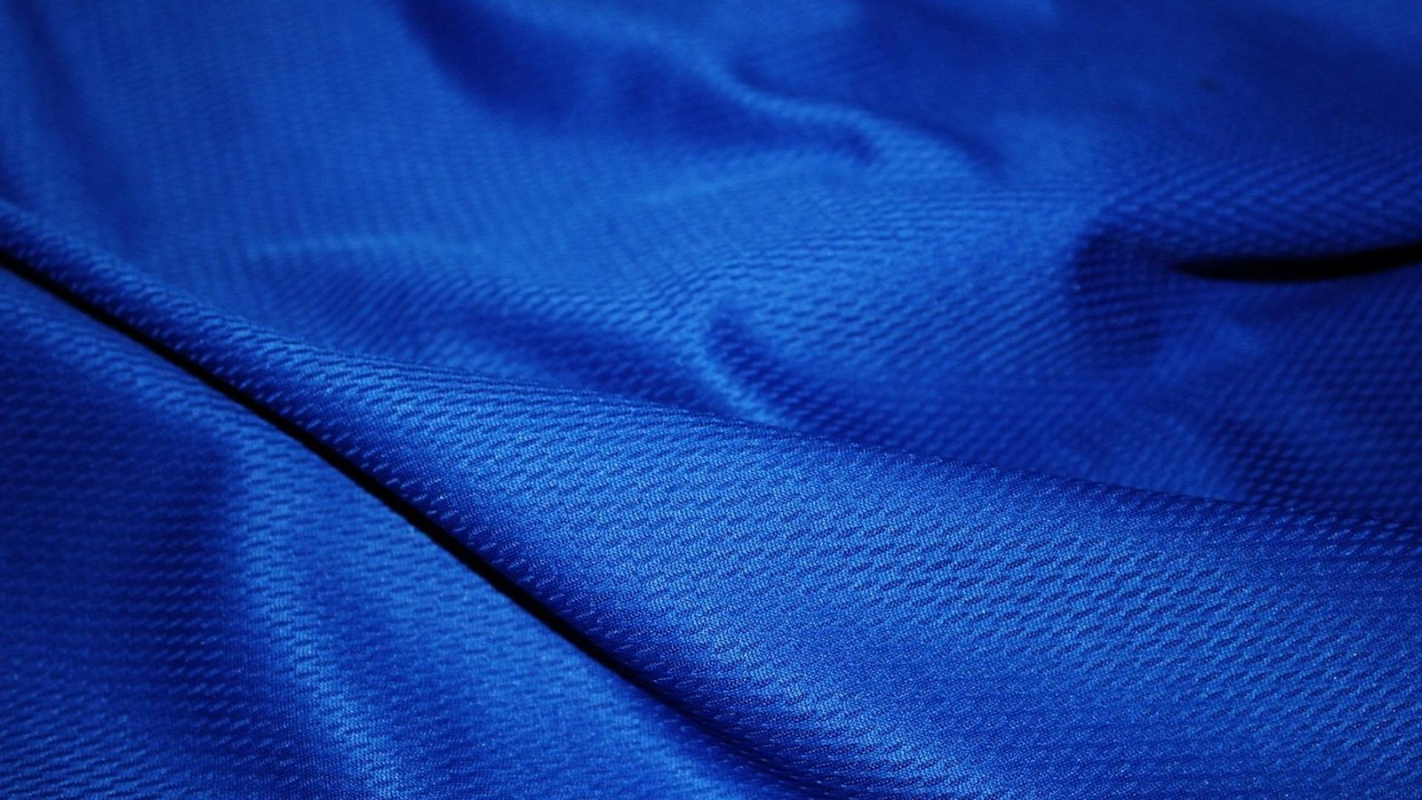 Detail modrej polyesterovej športovej látky